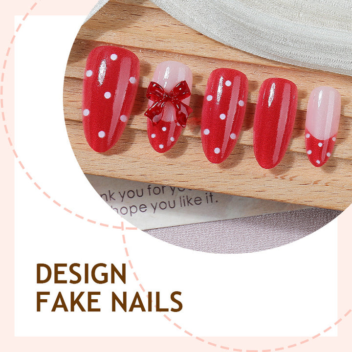 Kunstnagelset mit verspielten roten Polka Dots und Schleifen Akzenten Karnz