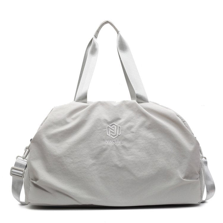 Kompakte Reis-Handtasche