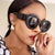 Damen extravagante Sonnenbrille mit kreativem Rahmendesign und schützendem UV-Filter Karnz