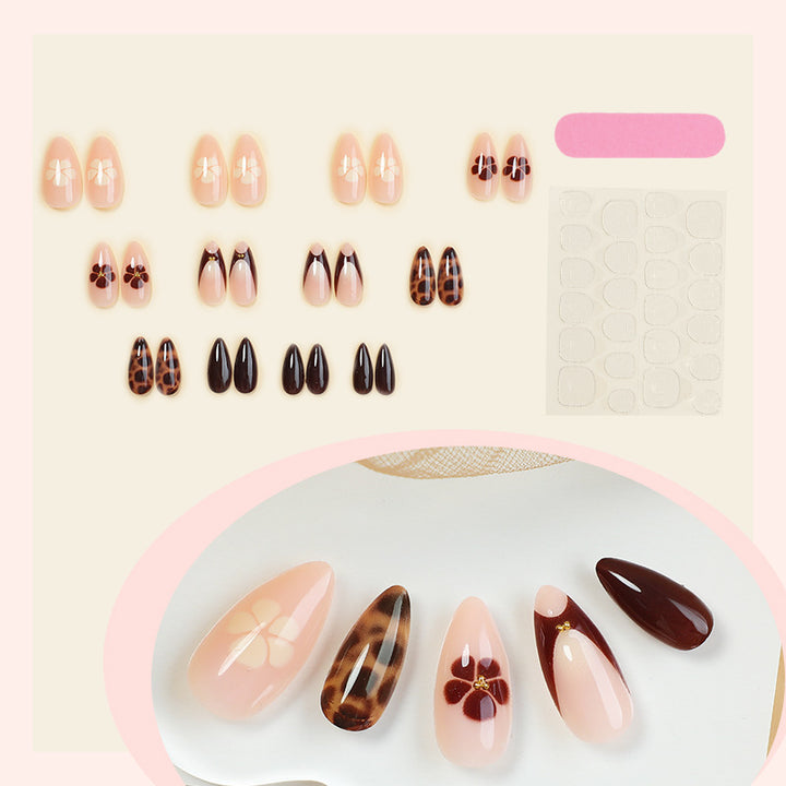 Künstlerisches Press-On-Nagelset mit floralen und tierischen Drucken Karnz