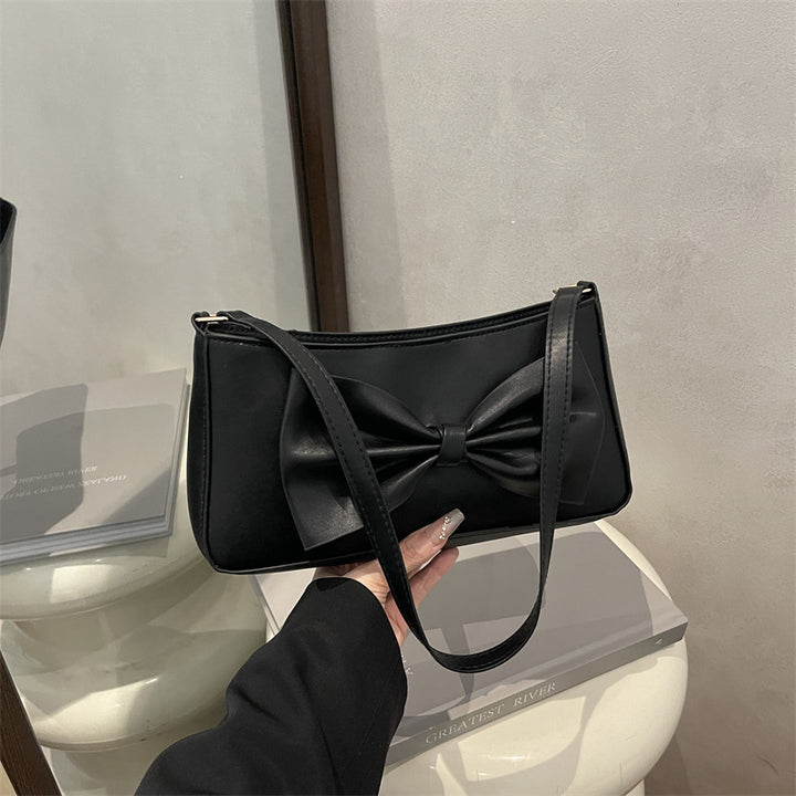 Elegante Clutch mit Schleifen-Detail für den Abend