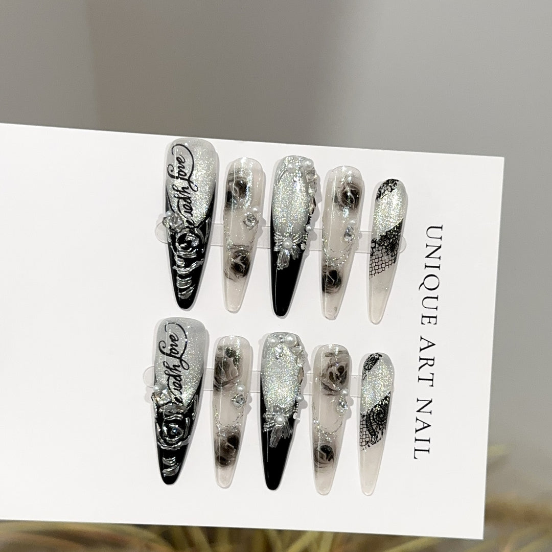 Elegantes Stiletto Press-On Nagelkunstset mit floralem und edelsteinartigem Akzenten