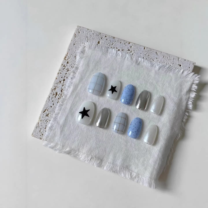 Künstlerisches Press-On-Nagelset mit geometrischen und Sternmustern