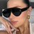 Damen moderne Fashion-Sonnenbrille im futuristischen Design Karnz