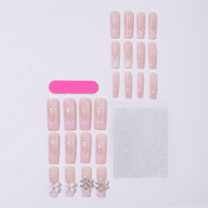 Kreatives Kunstnagelset mit zarten Blumen- und Glitzerakzenten Karnz