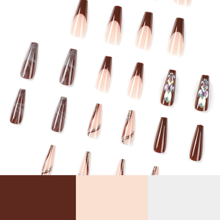 Künstliche Nagelverlängerungen mit eleganten Edelsteinverzierungen Karnz