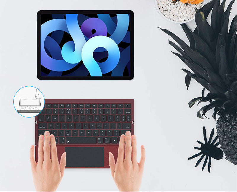 Kompakte kabellose Tastatur mit Touchpad Karnz