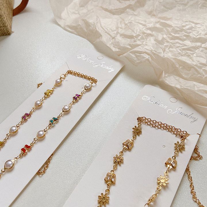 Stilisierte Brillenhalterkette mit Bunten Kristallen Karnz