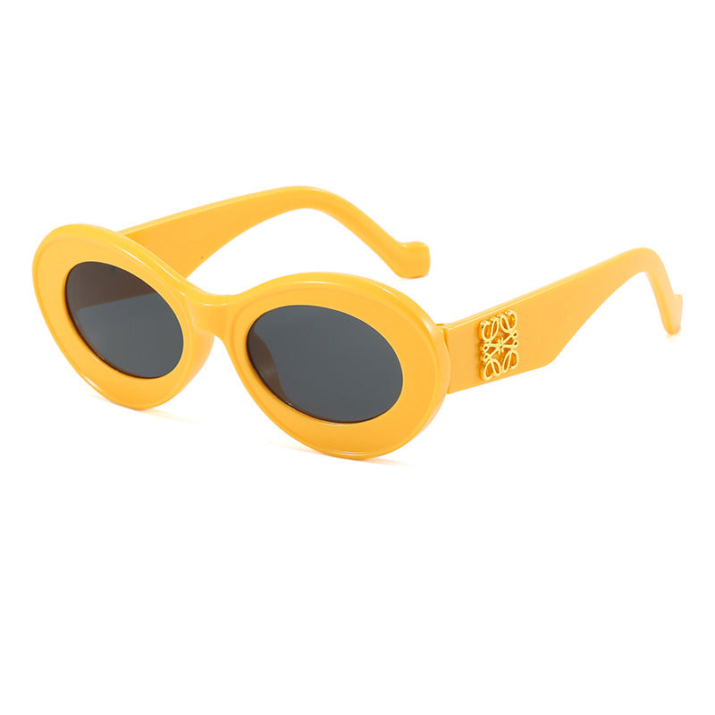 Damen modische Sonnenbrille mit ovalem Rahmen und goldenen Applikationen Karnz