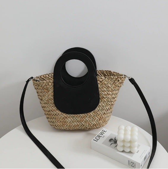 Damen Handtasche aus geflochtenem Material mit Lederdetails Karnz