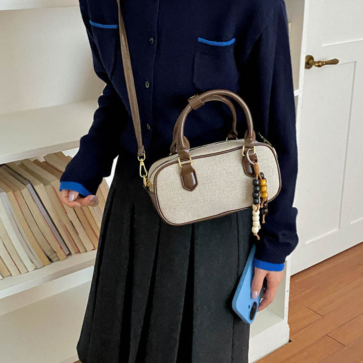 Vintage-inspirierte glänzende Handtasche