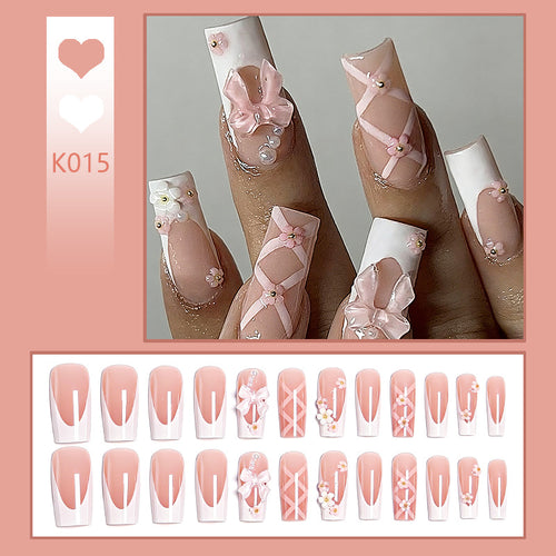 Kunstvolle 3D Nagelspitzen mit Schleifenmotiven Karnz
