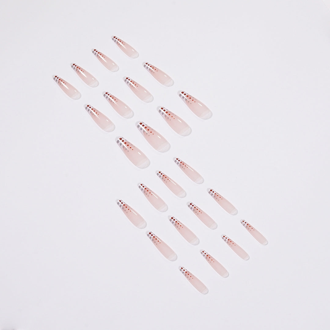 Kunstvolle Nagelverlängerungen mit eleganten Dots und schimmerndem Ombré Karnz