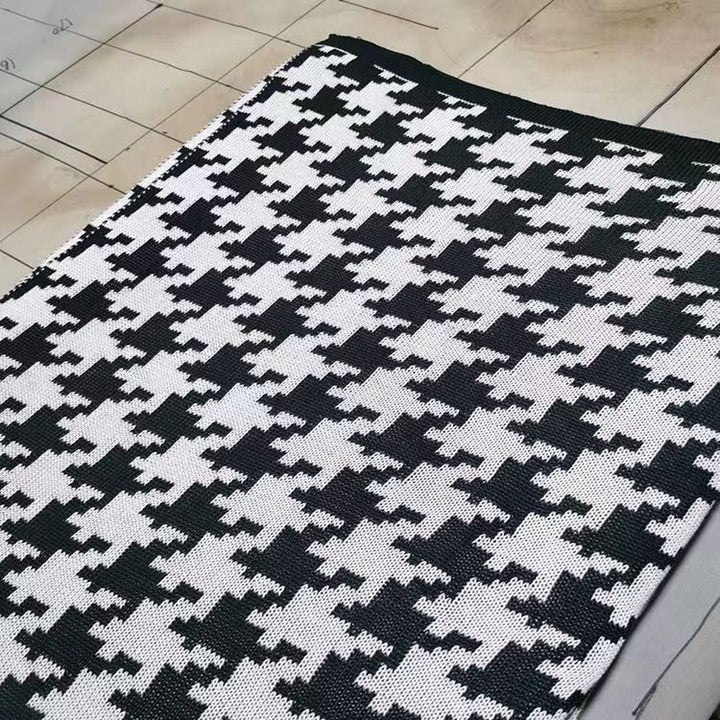 Hahnentrittmuster Strickwurfdecke