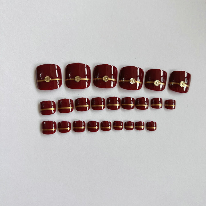 Künstliche Fußnägel mit eleganten Goldverzierungen Karnz