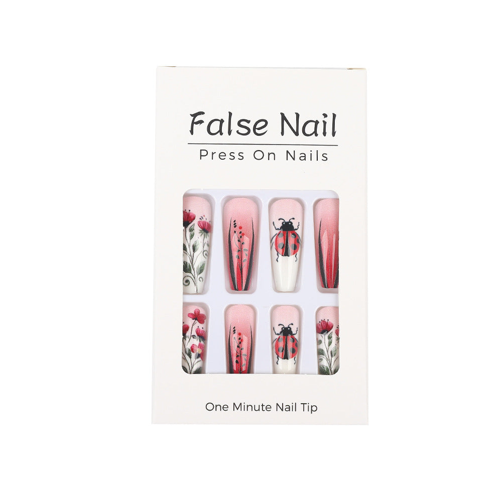 Kreatives Kunstnagelset mit floralen Motiven Karnz