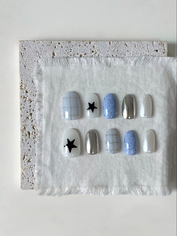 Künstlerisches Press-On-Nagelset mit geometrischen und Sternmustern
