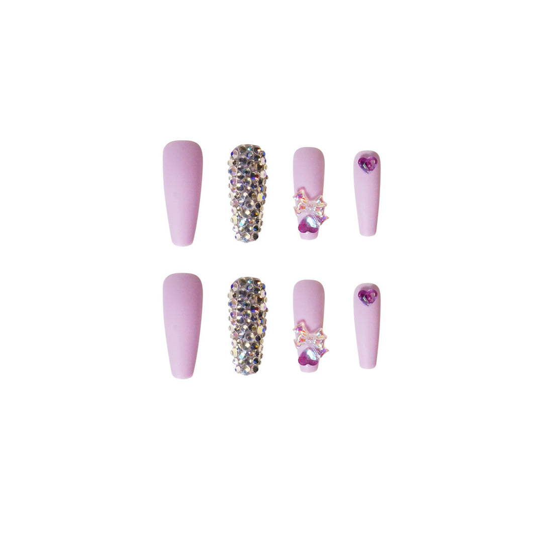 Kunstvolle Stiletto-Nägel mit Glitzer- und Blumenverzierungen Karnz