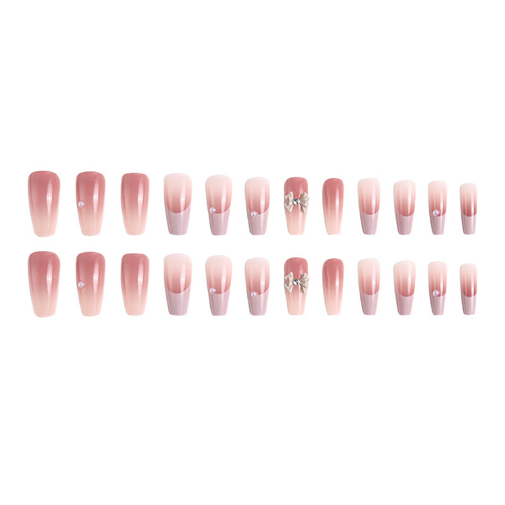 Kunstnagelset mit elegantem Ombre-Design und filigranen Schleifenverzierungen Karnz