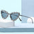 Damen Herzförmige Designer-Sonnenbrille mit glamourösem Kristallrahmen Karnz