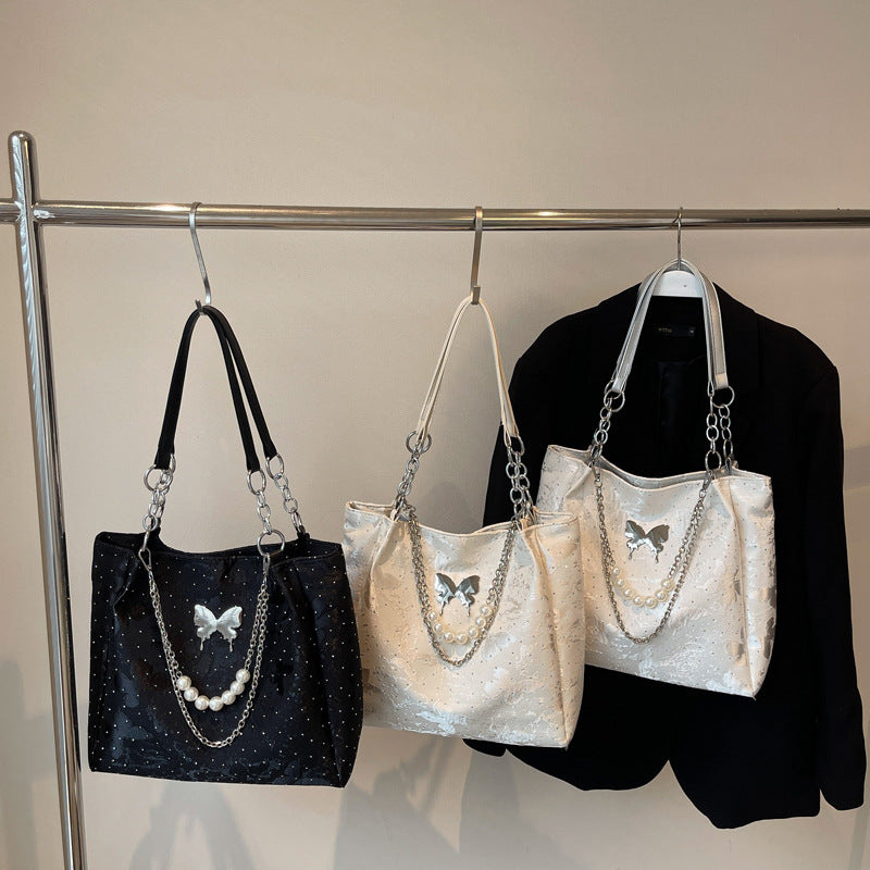 Elegante Handtasche mit Perlendetails Karnz