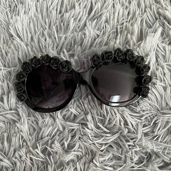 Damen Sonnenbrille mit floralen Akzenten Karnz