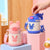 Damen Isolierte Kindertrinkflasche mit praktischem Tragegurt Karnz