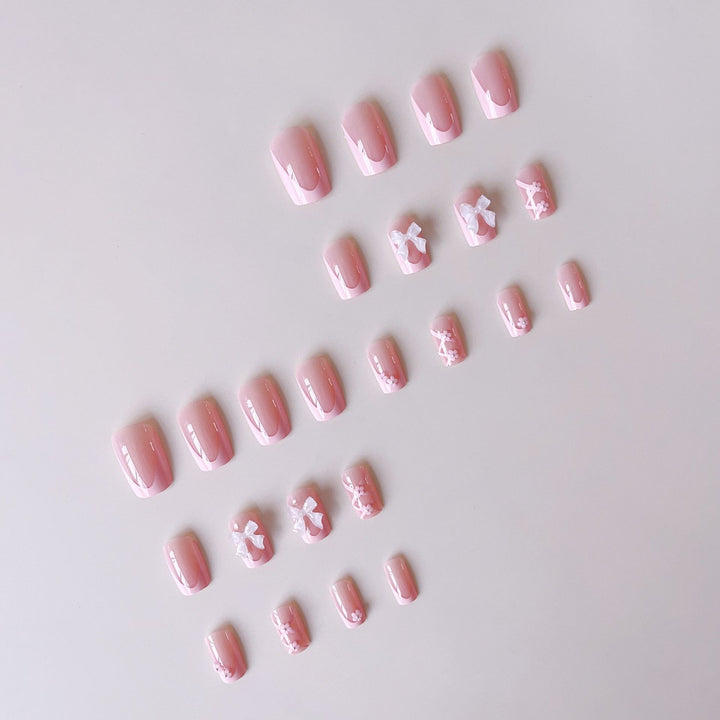 Kunstnagelset mit filigranen 3D-Blüten und Schleifen Karnz
