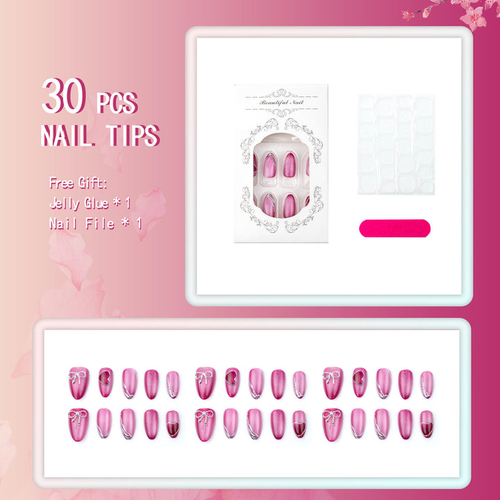 Kunstnagelset mit eleganten Herz- und Schleifenverzierungen Karnz