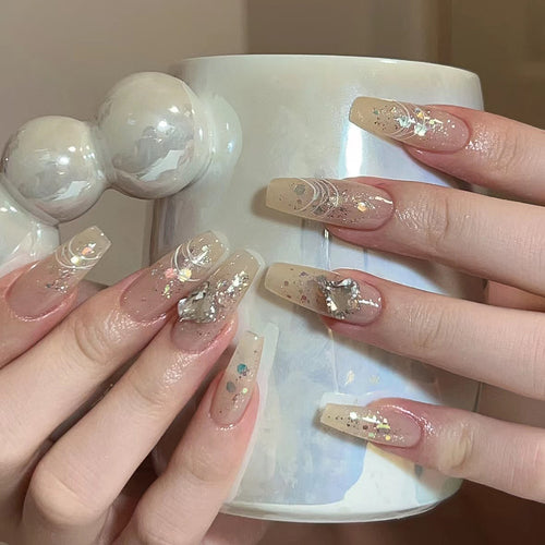Elegante Nagelverlängerungen mit Glitzer- und Blumendesign Karnz