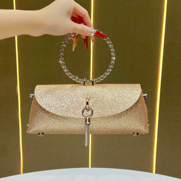 Glitzernde Clutch mit Strassgriff für den Abend