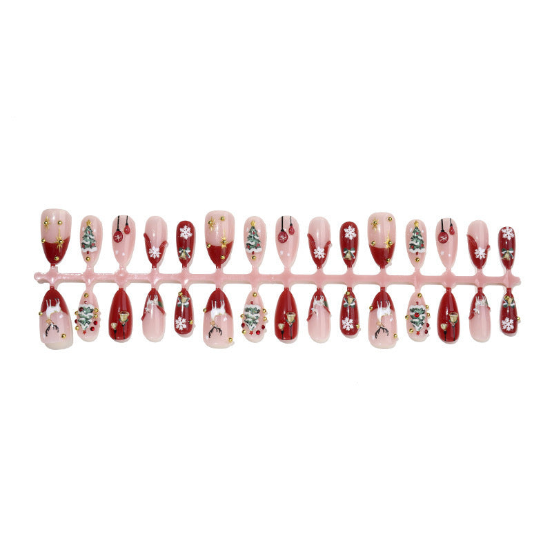 Kunstnagelset mit festlichen Motiven und Glitzerelementen Karnz