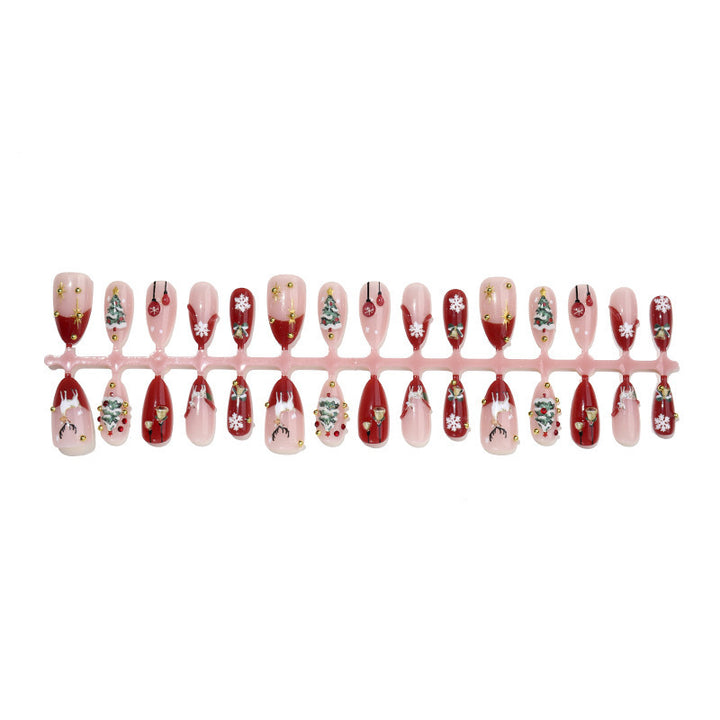 Kunstnagelset mit festlichen Motiven und Glitzerelementen Karnz