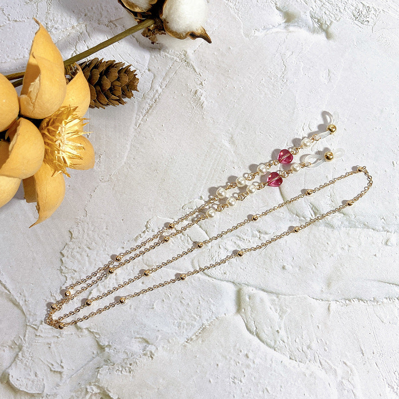 Elegante Kette mit Perlen und Rubinen Karnz