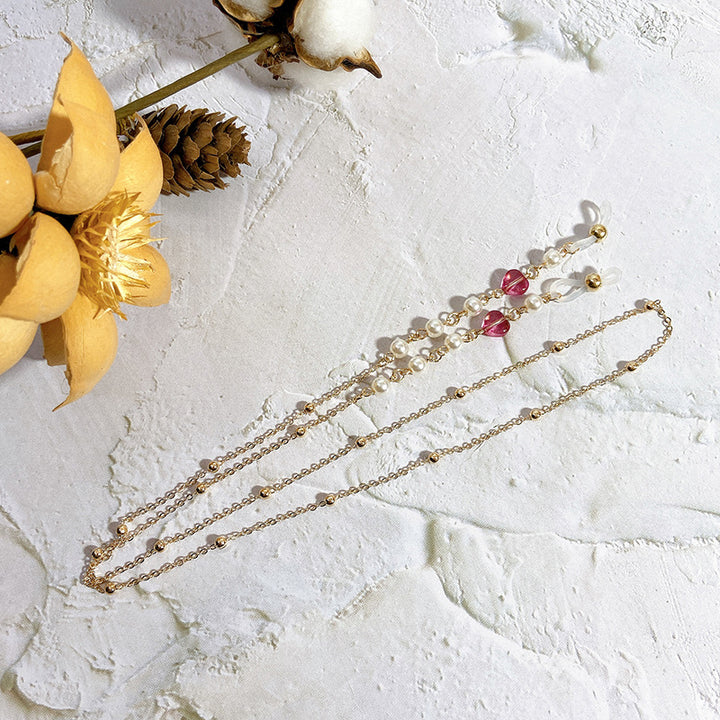 Elegante Kette mit Perlen und Rubinen Karnz