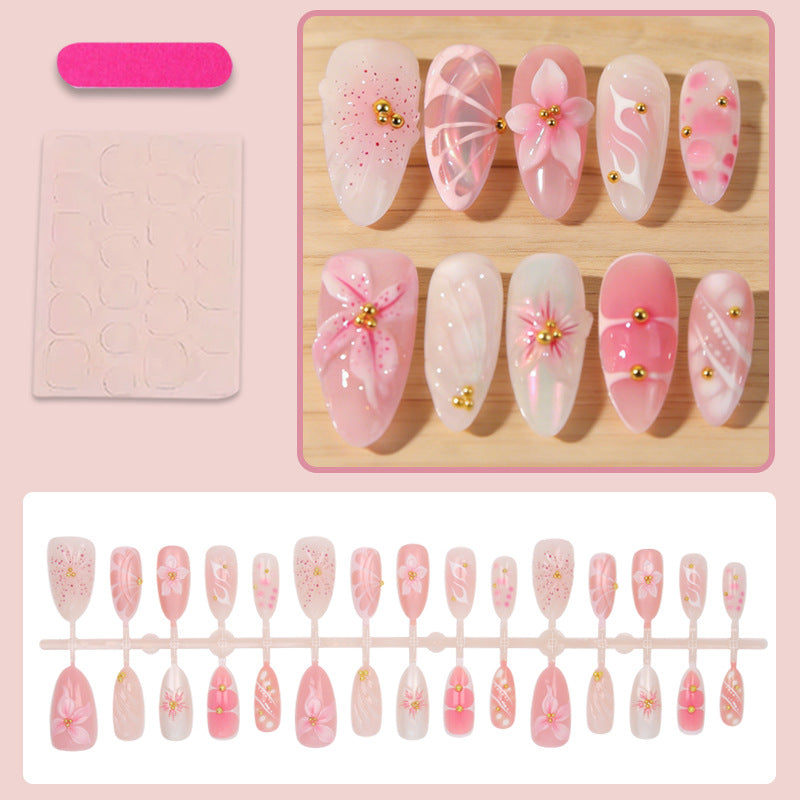 Kunstnägel mit floralen Designs und Glitzerakzenten Karnz
