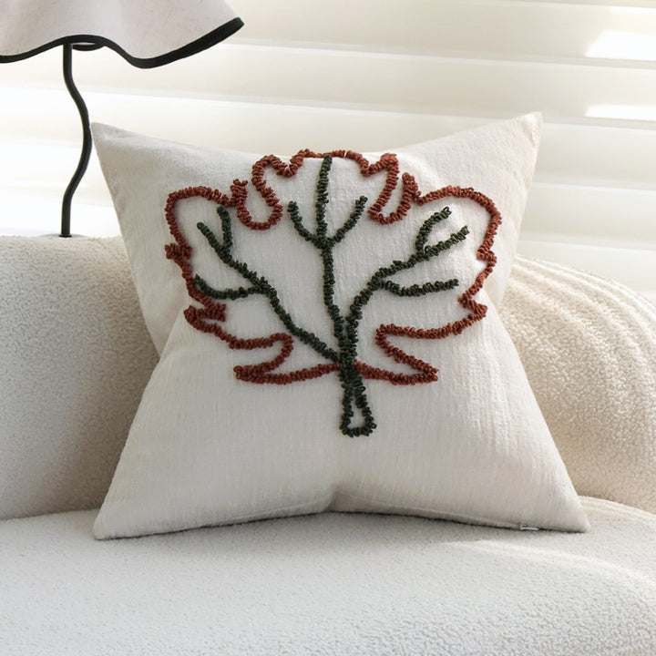 Dekoratives Kissen mit botanischem Blätterdesign