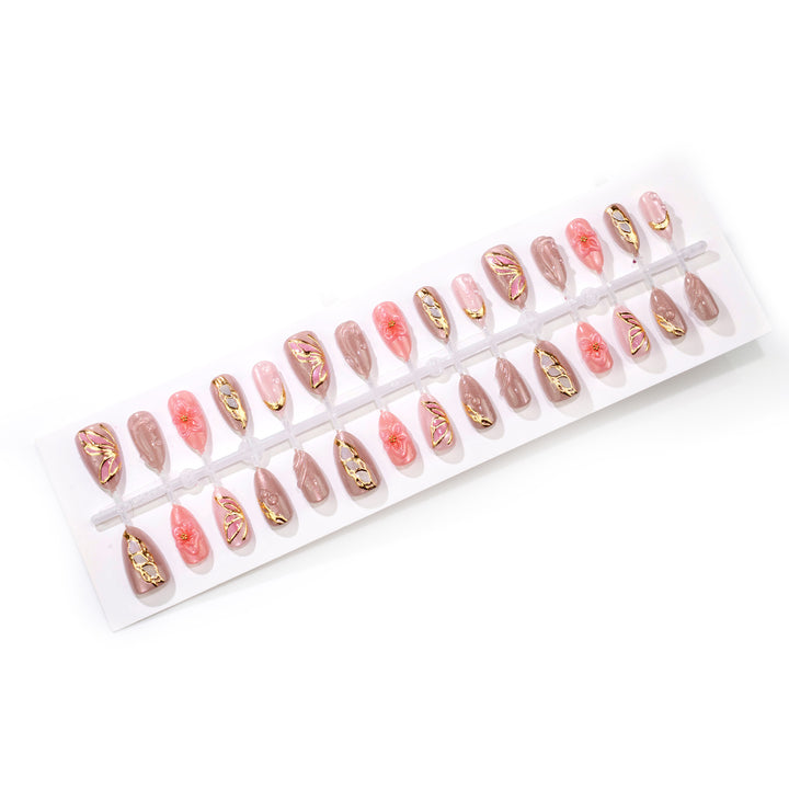 Künstlerisches Floral Press-On Nagelkunstset mit eleganten Edelsteindetails Karnz