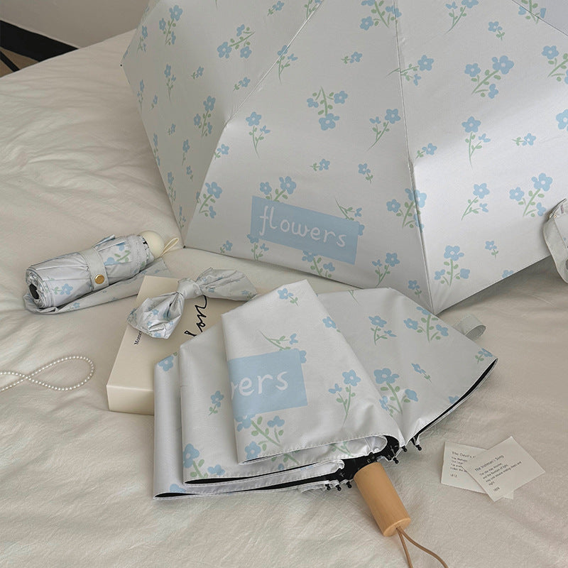 Damen Faltender Regenschirm mit stilvollem Blumendesign Karnz