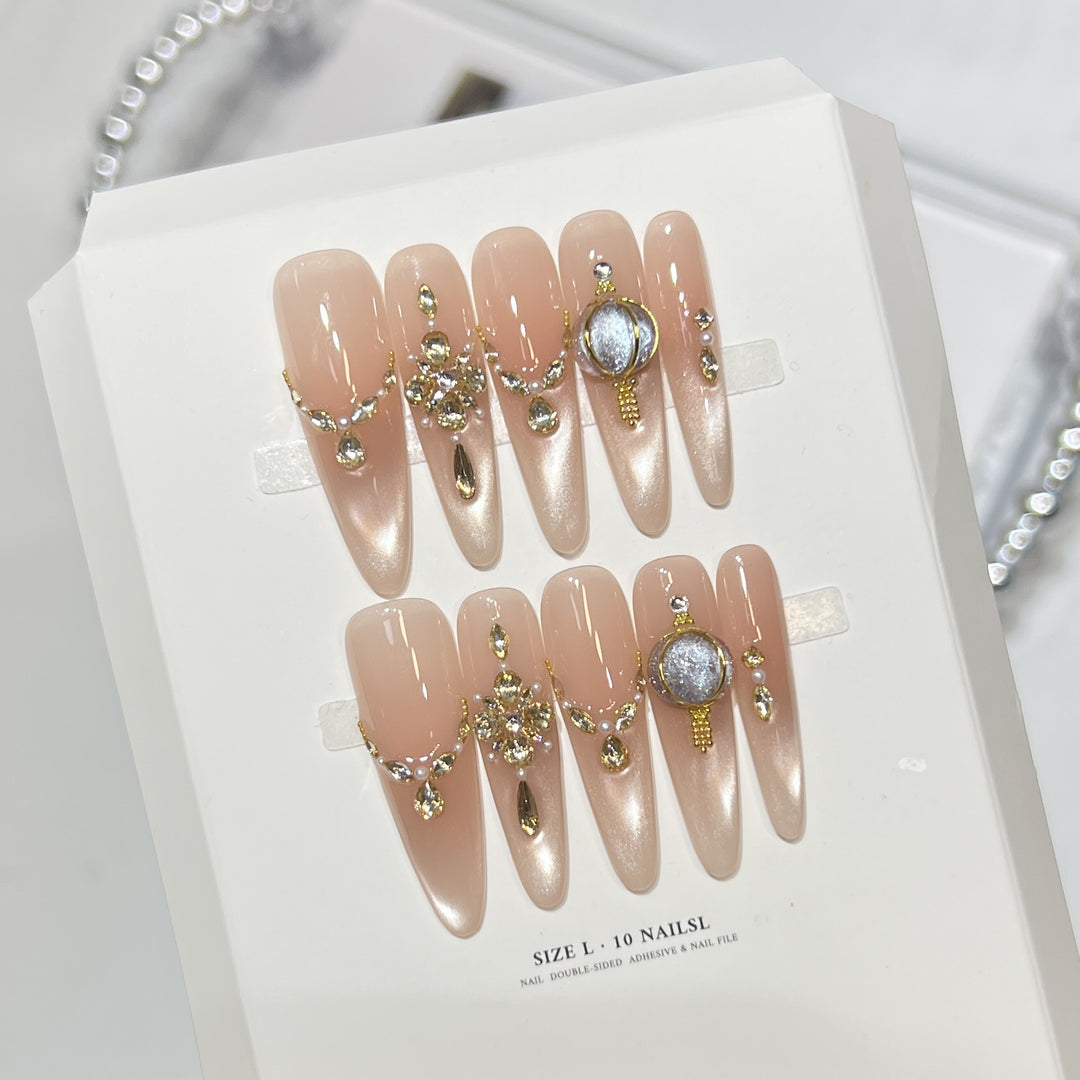 Dekoratives Stiletto Press-On Nagelset mit eleganten Schmucksteinverzierungen Karnz