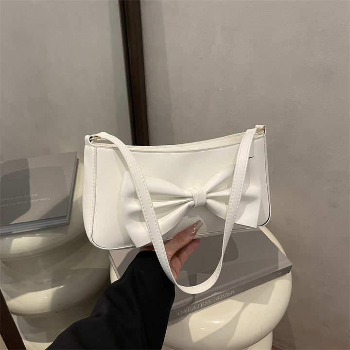 Elegante Clutch mit Schleifen-Detail für den Abend