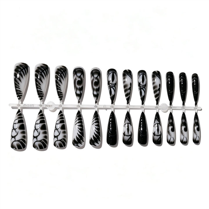 Künstlerisches Stiletto Press-On Nagelset Karnz