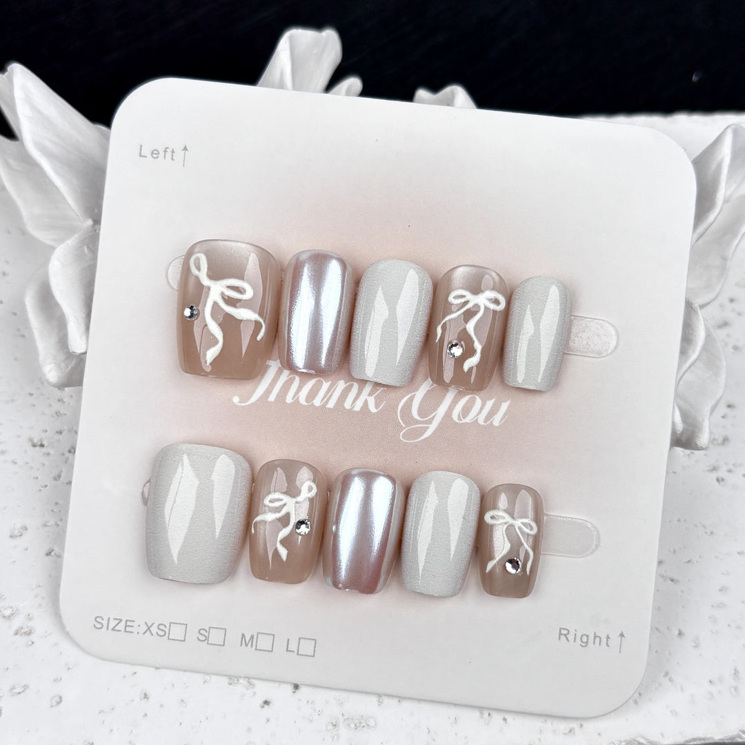 Elegantes Press-On Nagelkunstset mit Schleifenakzenten