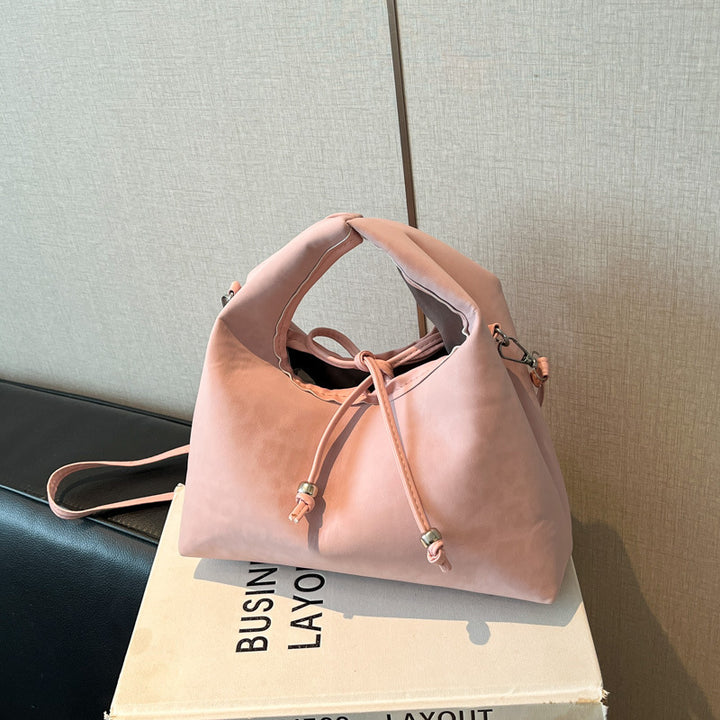 Stylische und funktionale Drawstring-Handtasche Karnz