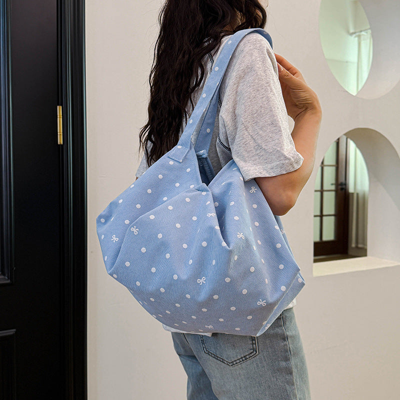 Moderne gepunktete Schultertasche