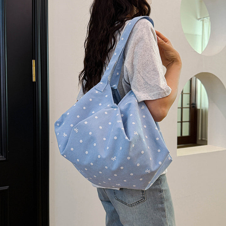 Moderne gepunktete Schultertasche