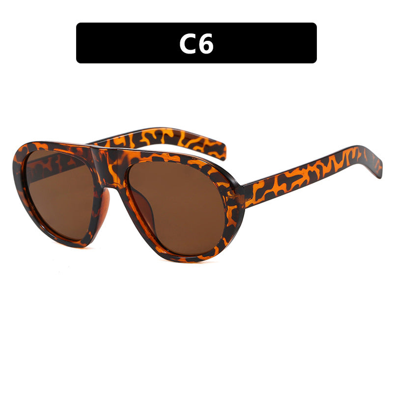 Damen auffällige Sonnenbrille mit futuristischem Rahmen und robustem Design Karnz