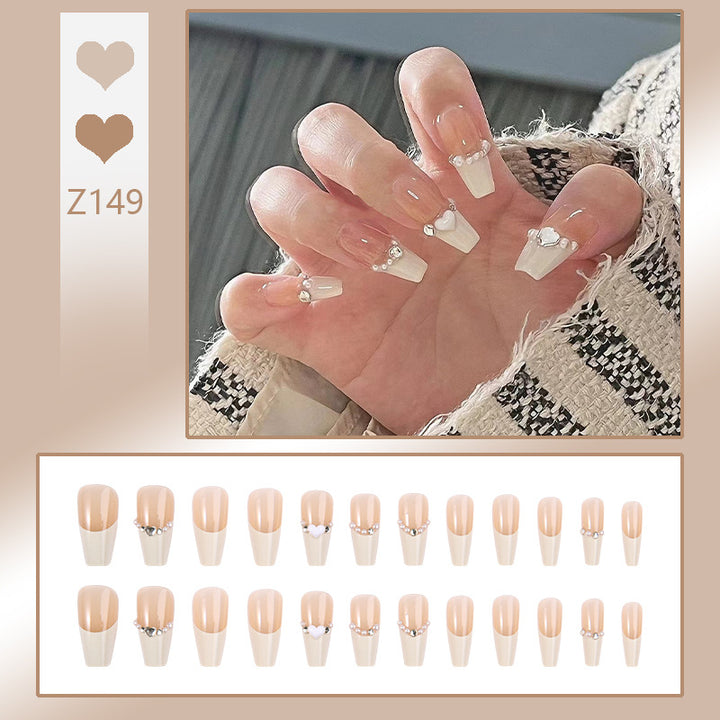Kunstnagelset mit eleganten Blumen- und Glitzerverzierungen Karnz