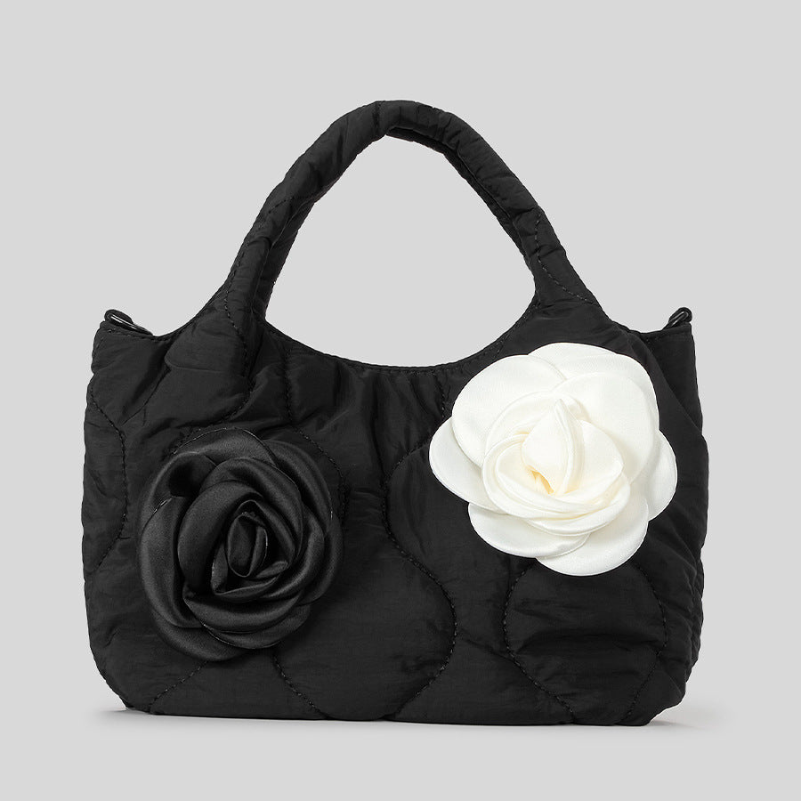 Blumengeschmückte gesteppte Handtasche