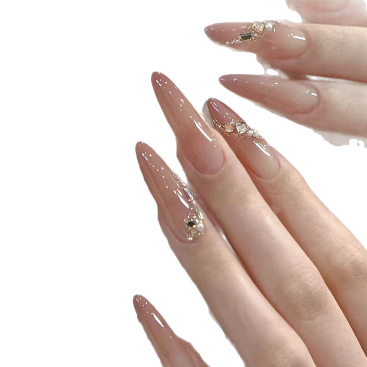 Elegante Stiletto Press-On Nagelset mit floralen und Edelsteinakzenten Karnz